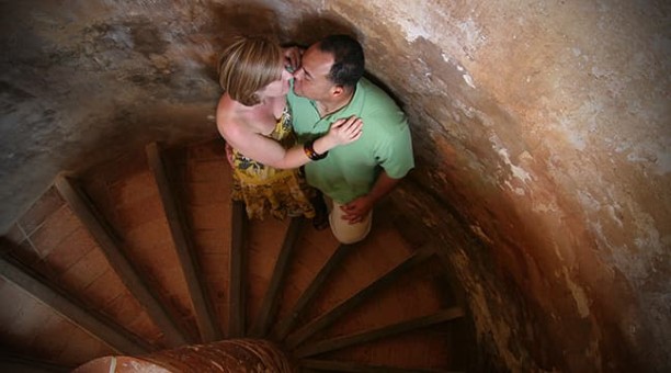 Engagement session at El Morro Castle spiral stairs
