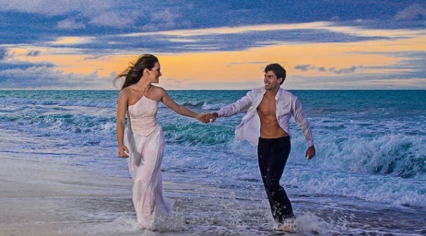 Couple in the beach during sunset