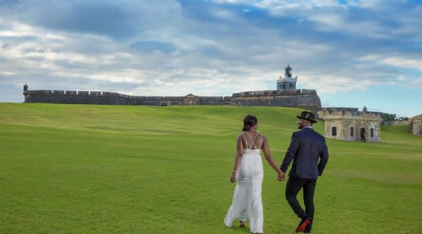 Couple walking towards El Morro Castle