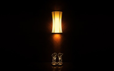 Wedding shoes in dark background under the lamp