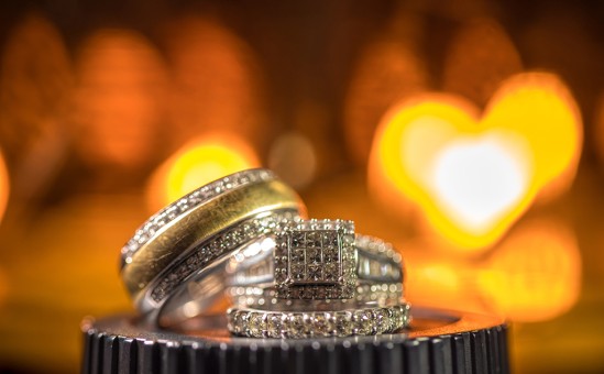 Wedding Rings with light heart in the background