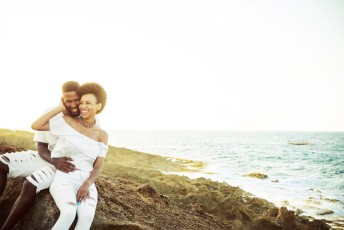 Couple in the rocks close to the beach