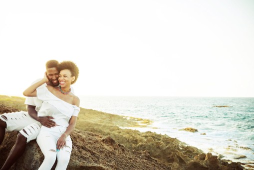 Couple in the rocks close to the beach