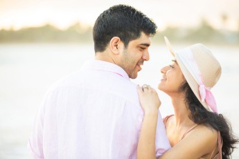 Indian couple at the beach in a romantic pose at the beach