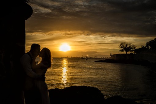 Romantic kiss during sunset at El Morro Castle in Old San Juan, Puerto Rico